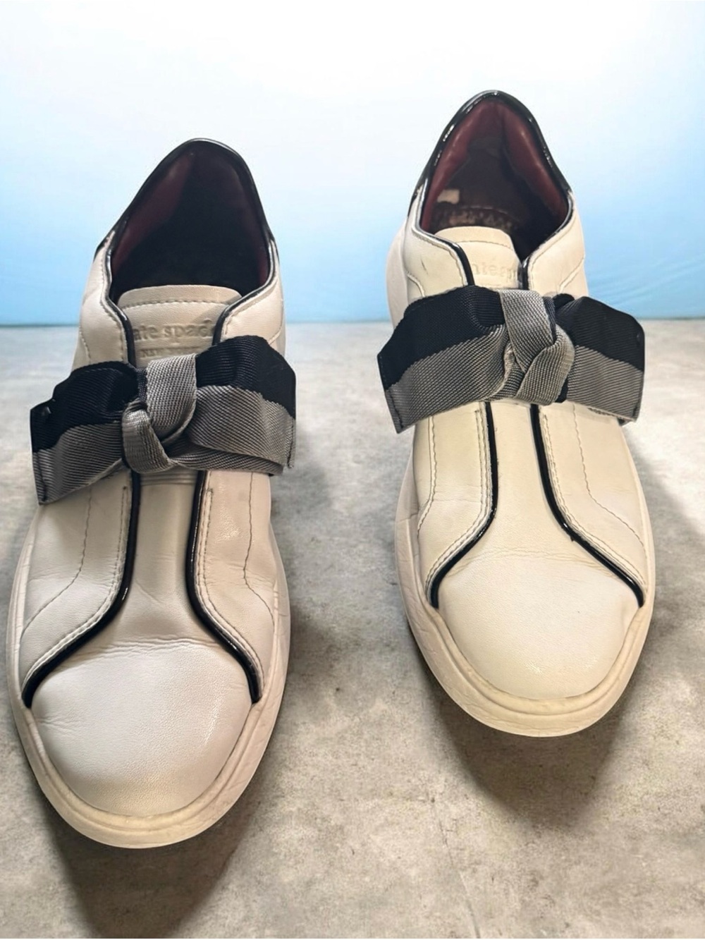 Kate Spade Cream Leather Slip-On Sneakers with Black & Gray Bow